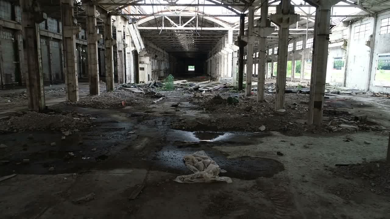 Inside an empty industrial hall before dismantling